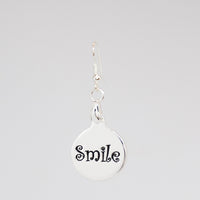 Smile Charm earring in silver back detail
