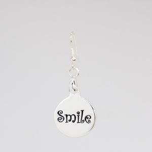 Smile Charm earring in silver back detail