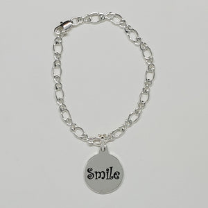 Introducing the Smile Charm Bracelet: A Timeless Emblem of Joy!